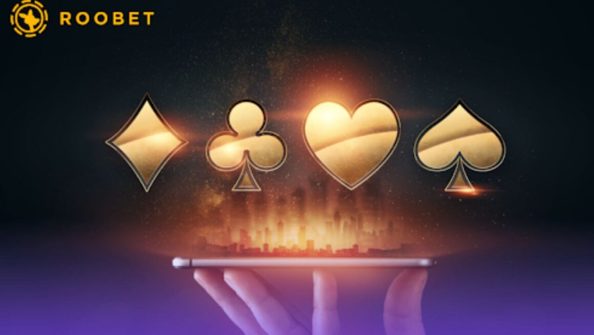 An image of the card suits found above a smartphone